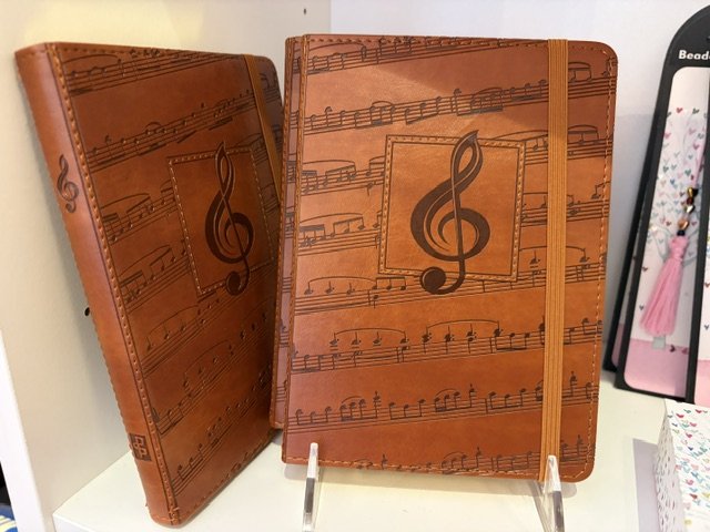 Leather journals embossed with sheet music at Paper Trails